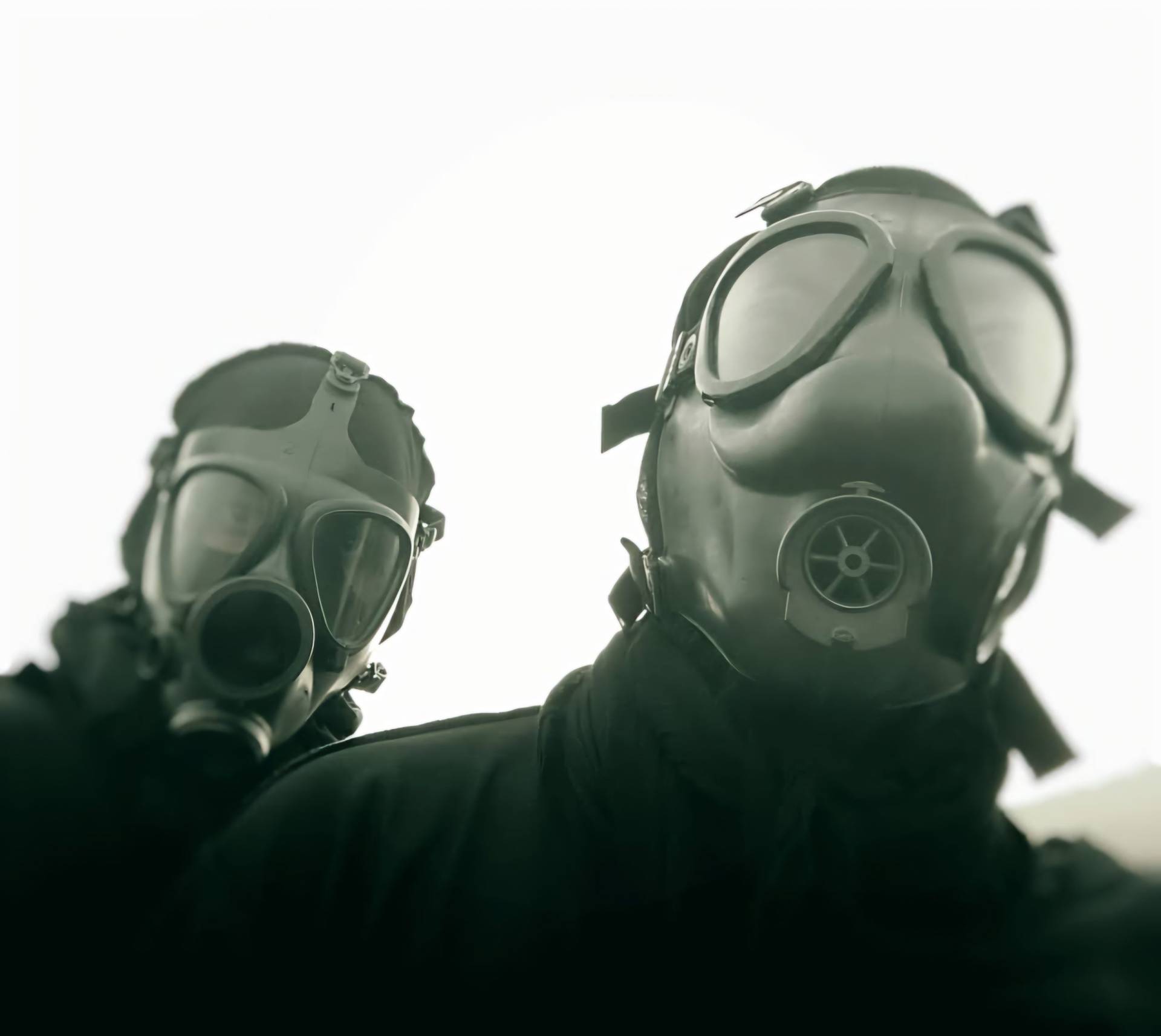the members of Wayloun in a mild green haze. One is staring at the camera and the other is looking beyond, maybe for a hope